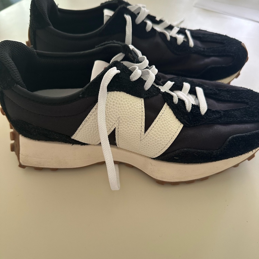 Women’s New Balance 327 sneakers. Size 9 1/2. Black and white.
